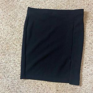 Tight fitting formal skirt with a small slit